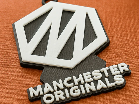 Le badge du porte-clés Hundred Manchester Originals est imprimable et rendu en couleur Modèles 3D en vedette